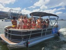 a group of people in a boat docked next to a body of water